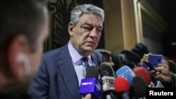 Romania's Prime Minister Mihai Tudose leaves a meeting of the Social Democrat Party (PSD) in Bucharest, Romania, Jan. 15, 2018.