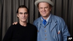 Joaquin Phoenix, left, and John C. Reilly, cast members in the film "The Sisters Brothers," pose together for a portrait at the Adelaide Hotel during the Toronto International Film Festival in Toronto, Sept. 8, 2018.