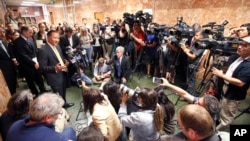 FILE - San Francisco Public Defender Jeff Adachi, left, talks to members of the media after Francisco Sanchez' arraignment in San Francisco, July 7, 2015. Adachi died in February.