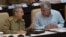 FILE - Cuba's President Raul Castro, left, talks with First Vice President Miguel Diaz-Canel during the opening of the National Assembly session in Havana, Cuba, July 8, 2016. 