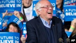 FILE - Democratic presidential candidate Sen. Bernie Sanders of Vermont laughs at a primary night rally in Essex Junction, Vermont, March 1, 2016.