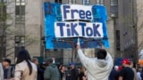 In this file photo, a man carries a Free TikTok sign in front of the courthouse where a trial of Donald Trump was underway on April 15, 2024, in New York. (AP Photo/Ted Shaffrey, File)