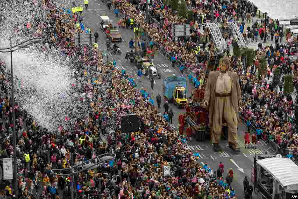 A huge puppet named Giant walks past the dockside in central Liverpool, north west England during a production by French street theater company Royal de Luxe entitled Liverpool&#39;s Dream.