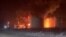 Fire and smoke rise at an oil depot following a Ukrainian drone attack, according to regional officials, in Novominskaya, Russia, in this screengrab obtained from a social media video released on Feb. 5, 2025. Social Media/via REUTERS