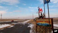  FILE - A sign welcoming visitors to the Blackfeet Indian reservation in Browning, Mont., Dec. 12, 2012. 