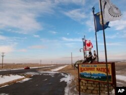 FILE - A sign welcoming visitors to the Blackfeet Indian reservation in Browning, Mont., Dec. 12, 2012. Montana might be known internationally for such recreational jewels as Glacier and Yellowstone national parks, but Native Americans say the state is losing an opportunity by failing to develop and promote its vast tribal lands as tourist destinations.