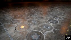 FILE - Radioactive waste sealed in large stainless steel canisters is stored under five feet of concrete in a storage building at the Savannah River Site near Aiken, South Carolina.