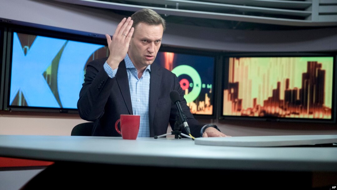 FILE - Russian opposition leader Alexei Navalny speaks at the Echo Moskvy (Echo of Moscow) radio station in Moscow, Russia, Dec. 27, 2017. 