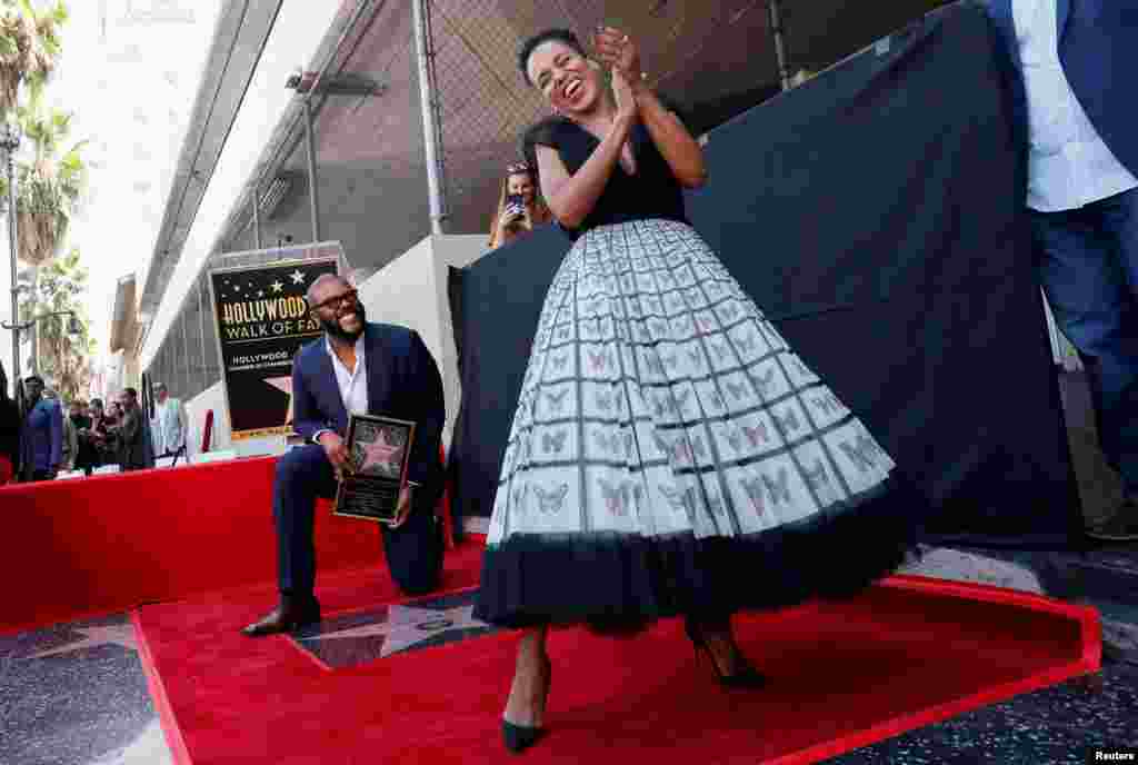 Actor Kerry Washington dances on movie mogul Tyler Perry&#39;s star during its unveiling on the Hollywood Walk of Fame in Los Angeles, California, Oct. 1, 2019.