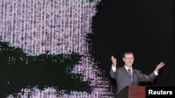 Syria's President Bashar al-Assad speaks at the Opera House in Damascus January 6, 2013, in this handout photograph released by Syria's national news agency SANA.