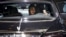A visitor takes a selfie inside a Rolls-Royce presented during the Auto China 2016 auto show in Beijing, April 25, 2016. 
