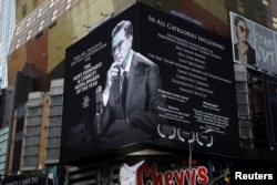 Sebuah papan reklame menayangkan promosi acara bincang-bincang malam Stephen Colbert di dekat New York's Times Square, New York, 16 January 2018.