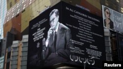 A billboard late-night talk show host Stephen Colbert is seen near New York's Times Square, January 16, 2018. Colbert is jokingly campaigning for President Trump's "fake news awards." 