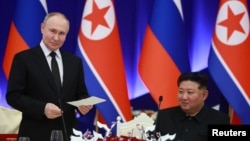 Президент Росії Володимир Путін і лідер Північної Кореї Кім Чен Ин під час підписання угоди в Пхеньяні, 19 червня 2024 року. Фото: Sputnik/Vladimir Smirnov/via Reuters
