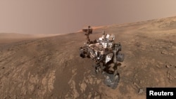 FILE - NASA's Curiosity Mars Rover snaps a self-portrait at a site called Vera Rubin Ridge on the Martian surface in Feb. 2018 in this image obtained on June 7, 2018. 