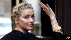 American actress Amber Heard arrives at the High Court in London in London, July 22, 2020.