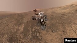 FILE - NASA's Curiosity Mars Rover snaps a self-portrait at a site called Vera Rubin Ridge on the Martian surface in Feb. 2018 in this image obtained on June 7, 2018. 