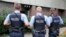 FILE - German police officers guard outside the regional court in Frankfurt, Germany, Monday, Sept.15, 2014.