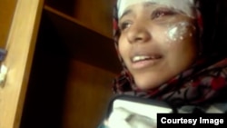 In a screen grab from the “Trials of Spring” documentary, Hend Nafea is seen recovering from physical harm sustained at the hands of security forces during protests in Cairo, in 2011.