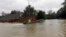 A rescue boat enters a flooded subdivision as floodwaters from Tropical Storm Harvey rise Aug. 28, 2017, in Spring, Texas.