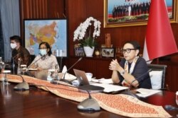 Menteri Luar Negeri Retno Marsudi dalam pertemuan virtual dwi-mingguan “Ministerial Coordination Group on COVID 19 (MCGC)”, Selasa (12/5). (Foto: Humas Kemlu)