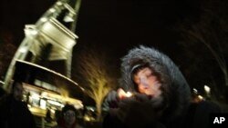 Man smokes marijuana just after midnight at the Space Needle in Seattle, Washington, Dec. 6, 2012.