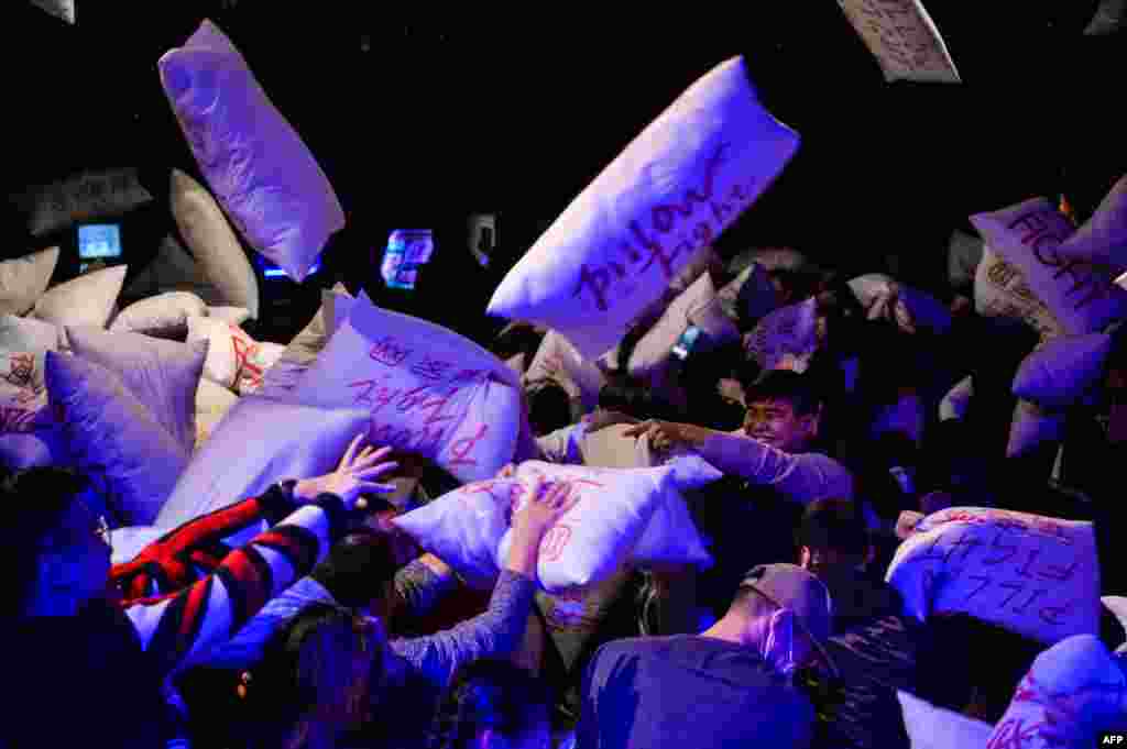 Chinese residents take part in a &#39;Pillow Fight Night&#39; during an event to mark Christmas eve in Shanghai.