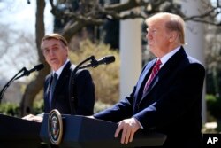 President Donald Trump and visiting Brazilian President Jair Bolsonaro speak during a news conference in the Rose Garden of the White House, March 19, 2019.