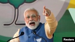 FILE - India's Prime Minister Narendra Modi addresses an election campaign rally ahead of the Karnataka state assembly elections in Bengaluru, India, Feb. 4, 2018.