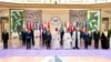 A hand out picture provided by UAE Presidential Court on October 20, 2023, shows (front L- R) Vietnam's Prime Minister Pham Minh Chinh, Crown Prince of Kuwait Sheikh Mishal al-Ahmad al-Jaber al-Sabah, President of Indonesia Joko Widodo, the Emir of Qatar