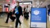 A flight crew walk through the terminal at Sydney Airport, Nov. 29, 2021.