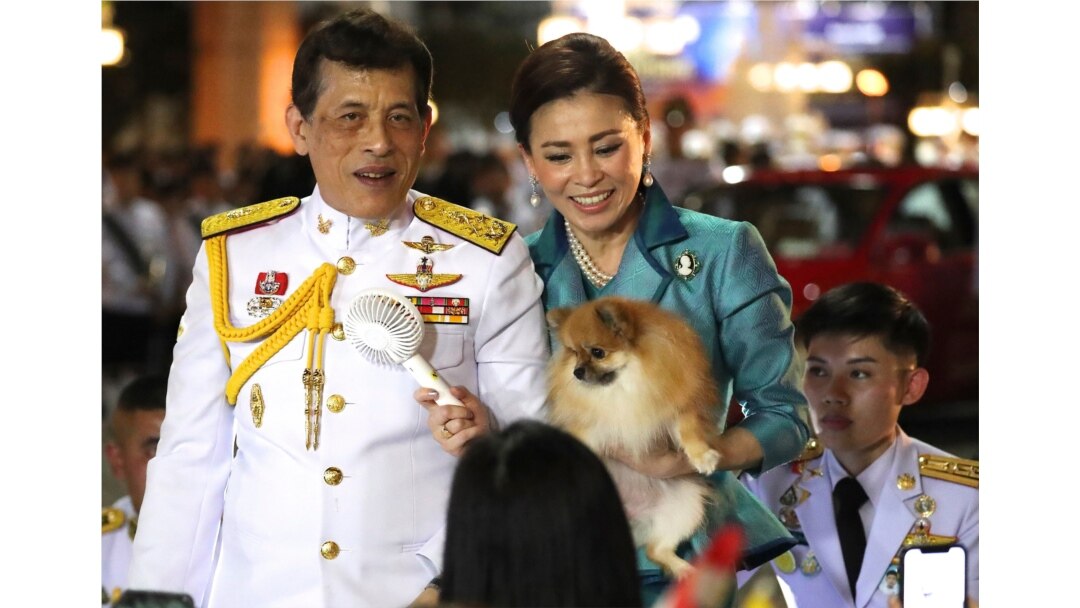 Thai King Maha Vajiralongkorn, left, and Queen Suthida meet supporters after attending a ceremony to mark an anniversary of the death of King Vajiravudh in Bangkok, Thailand, Nov. 25, 2020.
