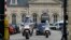 Policemen escort the vehicle transporting Mehdi Nemmouche, the Frenchman suspected in the shooting deaths of three people at the Brussels Jewish Museum, as he leaves the Appeals Court of Versailles, France, June 5, 2014.