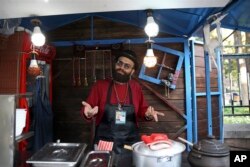 Hassan Aghaei, a 23-year-old street food vendor, speaks in downtown Tehran, Iran, Oct. 8, 2017.