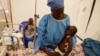 La survivante du virus Ebola, Jeanine Masika Mbuka, et Furana Katungu, ont été transférées dans l'unité de soins d'urgence Biosecure (Cube) de l'Alima (Alliance pour l'action médicale internationale), à Beni, en République Démocratique du Congo, le 31 mars 2019.