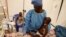 La survivante du virus Ebola, Jeanine Masika Mbuka, et Furana Katungu, ont été transférées dans l'unité de soins d'urgence Biosecure (Cube) de l'Alima (Alliance pour l'action médicale internationale), à Beni, en République Démocratique du Congo, le 31 mars 2019.