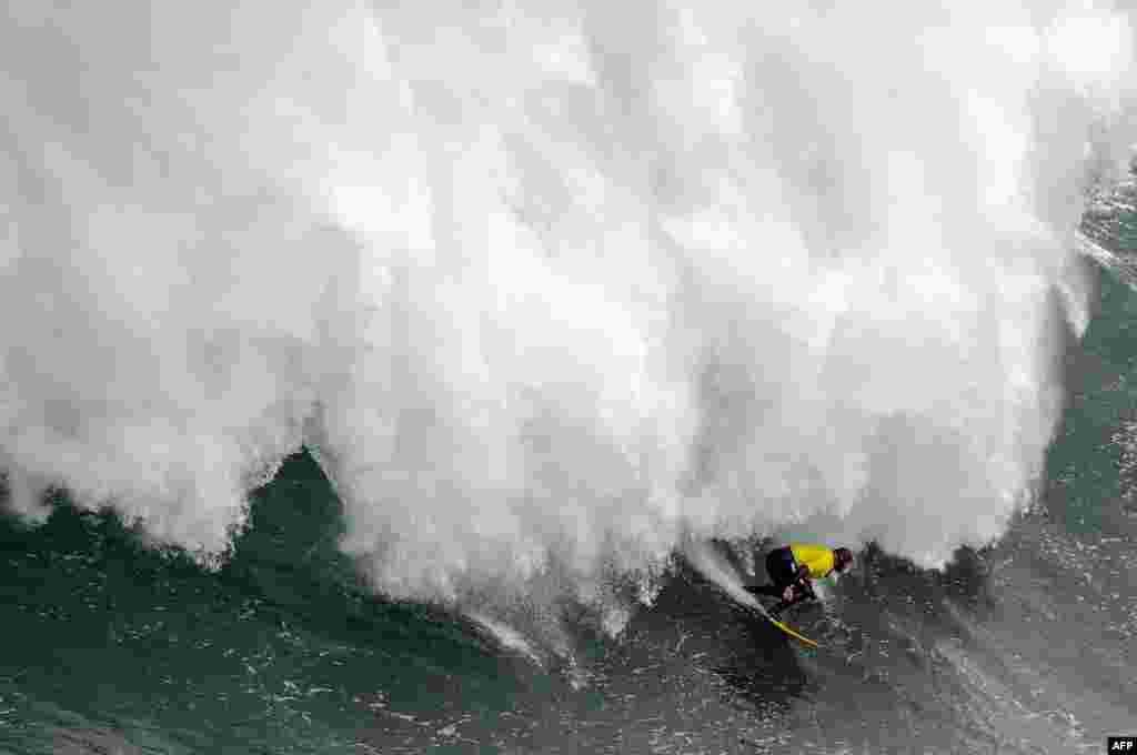 A big wave surfer competes during the Illa Pancha Challenge surfing competition in Ribadeo, Spain, Jan. 29, 2019.