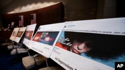 Facebook ads linked to a Russian effort to disrupt the American political process are displayed as Google's Senior Vice President and General Counsel Kent Walker, Facebook's General Counsel Colin Stretch, and Twitter's Acting General Counsel Sean Edgett, testify during a House Intelligence Committee hearing on Capitol Hill in Washington, Nov. 1, 2017. 