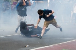 Protesters are tear gassed as the police disperse them near the White House in Washington, D.C., June 1, 2020 for President Donald Trump to be able to walk through for a photo opportunity in front of St. John's Episcopal Church in Washington.