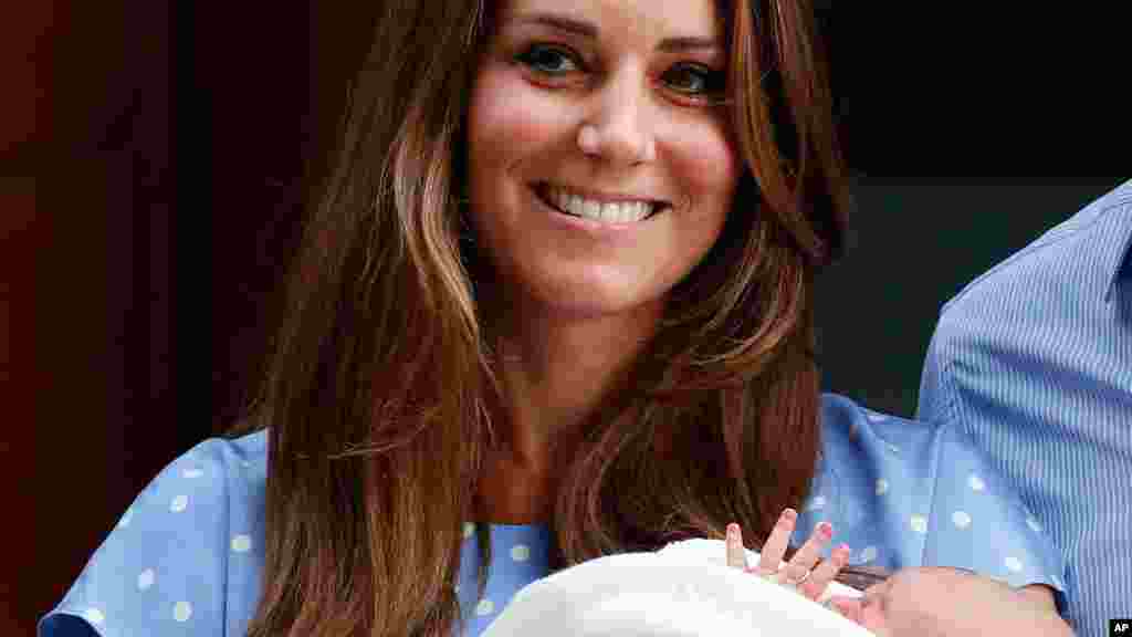 Kate, Duchess of Cambridge holds the Prince of Cambridge, July 23, 2013, outside St. Mary's Hospital in London.