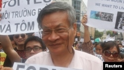 FILE - Nguyen Quang A joins a gather to protest against Taiwanese enterprise Formosa Plastic, says they are demanding cleaner waters in the central regions after mass fish deaths in recent weeks, in Hanoi, Vietnam.