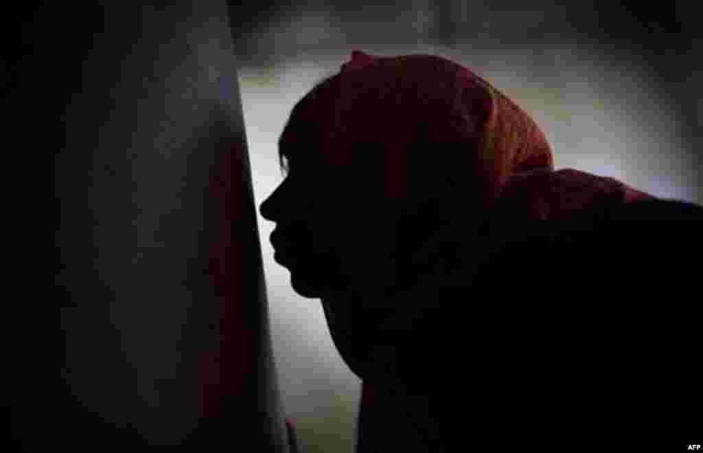 A worshipper kisses a pillar of the Church of the Nativity, traditionally believed by Christians to be the birthplace of Jesus Christ, during the Orthodox Christmas in the West Bank city of Bethlehem, Friday, Jan. 6, 2012. (AP Photo/Bernat Armangue)