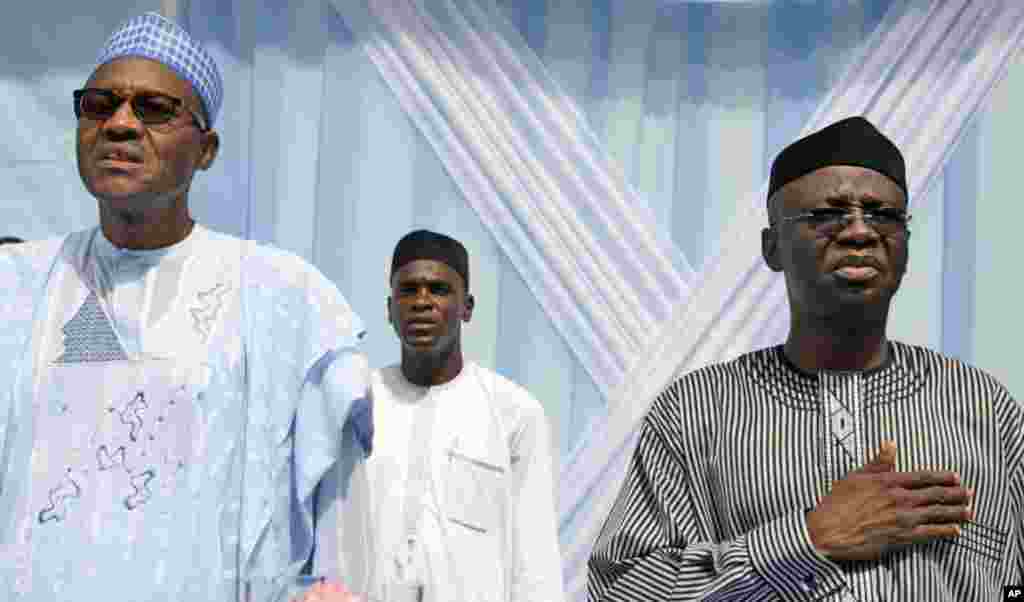 Gen. Muhammadu Buhari, presidential aspirant left, and his running mate Tunde Bakare, right, attend a Campaign rally in Lagos, Nigeria,Wednesday, April 6, 2011. A former military ruler of Nigeria has gained support in his third bid to become president of 