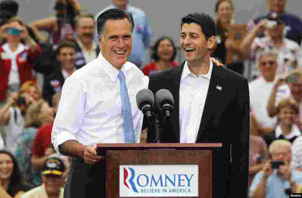 Republican U.S. Presidential candidate Mitt Romney (L) introduces Congressman Paul Ryan (R-WI) as his vice-presidential running mate during a campaign event at the retired battleship USS Wisconsin in Norfolk, Virginia, August 11, 2012.