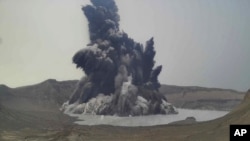 In this image made from video from Philippine Institute of Volcanology and Seismology Department of Science and Technology, a plume of steam and ash is seen from Taal Volcano, Batangas province, Philippines, July 1, 2021.