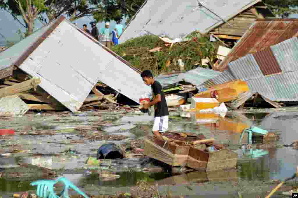 A man surveys the damage caused by earthquake and tsunami in Palu, Central Sulawesi, Indonesia,, Sept. 29, 2018.&nbsp;