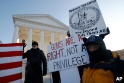 Gun-rights supporters demonstrate in front of state Capitol in Richmond, Va., Jan. 20, 2020.