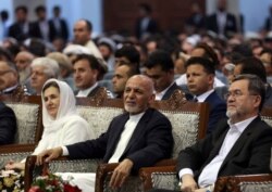 FILE - Afghan presidential candidate Ashraf Ghani, center, attends the first day of campaigning in Kabul, Afghanistan, July 28, 2019.