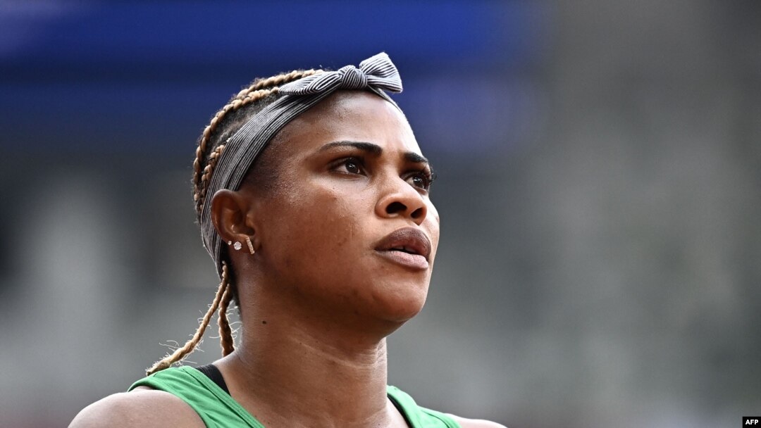 Nigeria's Blessing Okagbare reacts after winning her race in the women's 100m heats during the Tokyo 2020 Olympic Games at the Olympic Stadium in Tokyo on July 30, 2021. 