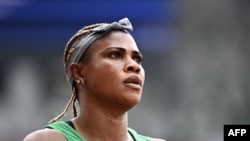 Nigeria's Blessing Okagbare reacts after winning her race in the women's 100m heats during the Tokyo 2020 Olympic Games at the Olympic Stadium in Tokyo on July 30, 2021. 